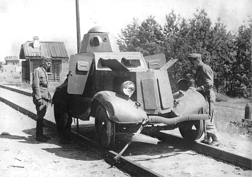 1941 Russia, Two German soldiers meet a Soviet armored car BA-20 Broneavtomobil 20 modified to travel on rails.jpg