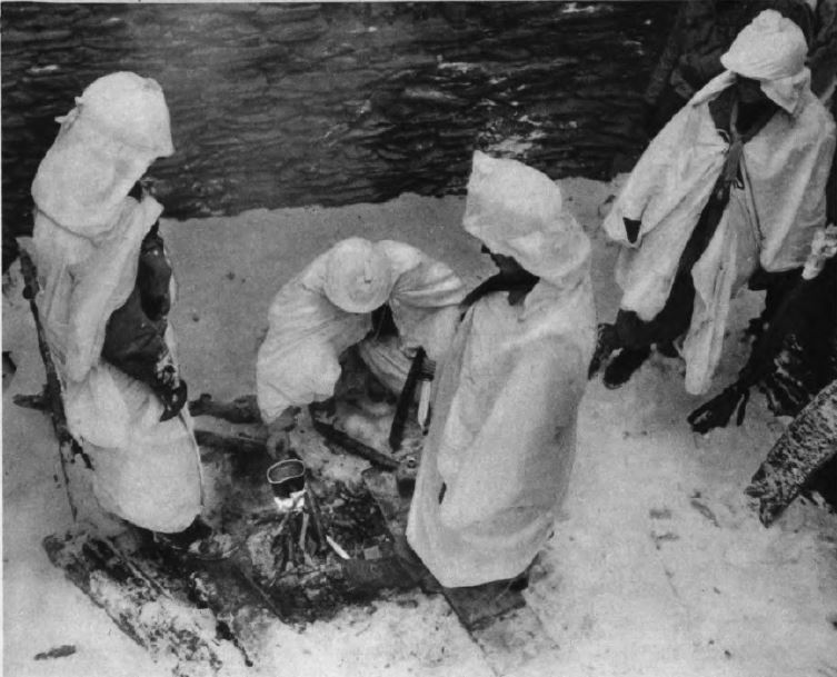 US - GI boil water under snow - Battle of the Bulge - 84th Inf Div - Battle of Germany.JPG