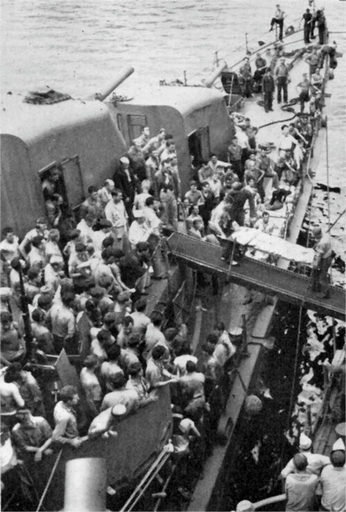 USS_Nicholas_(DD-449)_transfers_surviors_from_the_sunken_USS_Helena_(CL-50),_7_July_1943.jpg