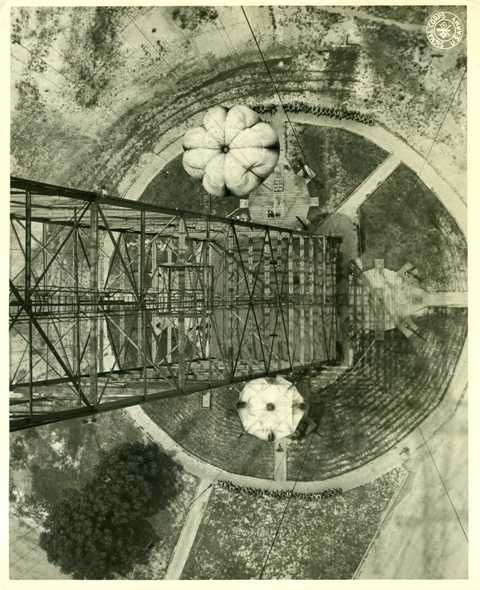 Caption Troopers jump from a training tower( Photo by Signal Corps) U.S. Army.jpg