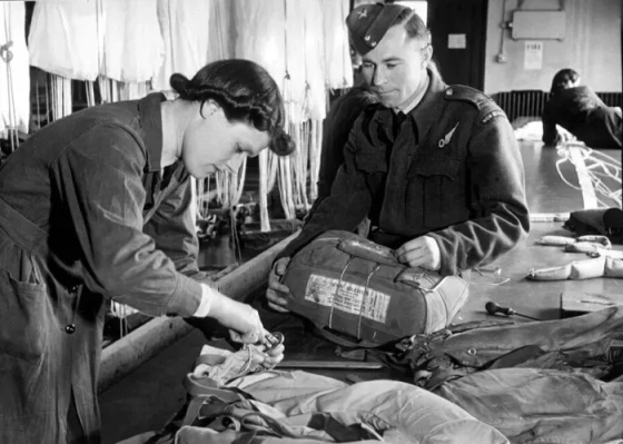 officer-observer-fetches-mae-west-parachute-checking-wafs-officer-21488085.jpg
